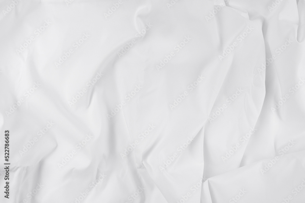 White fabric. luxurious white fabric texture background. Creases of satin, silk, and cotton. White fabric. luxurious white fabric texture background. Creases of satin, silk, and cotton.