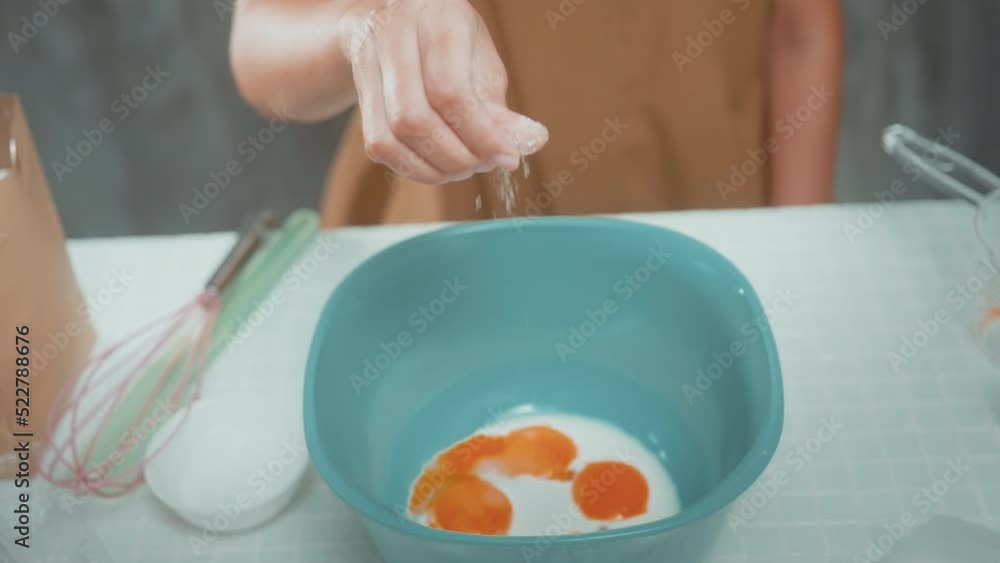 Young beautiful woman is baking in her kitchen , bakery and coffee shop business.. Young beautiful woman is baking in her kitchen , bakery and coffee shop business..