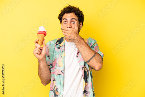 crazy bearded man covering mouth with hands with a shocked. ice cream and summer concept