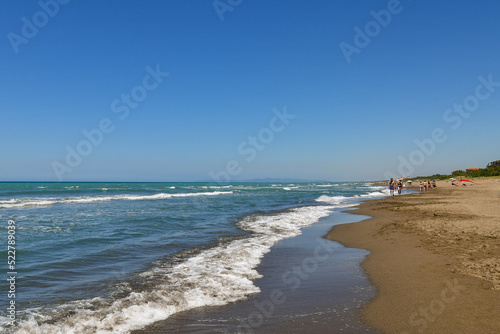 The sandy beach of San Vincenzo, a small fishing village on the Tuscan coast, popular tourist destination in summer, Livorno, Italy