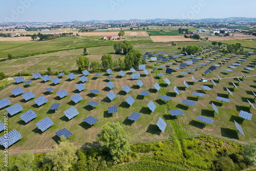 Silicon photovoltaic panels with defective single-axis tilted track system In a small solar power plant.  photo