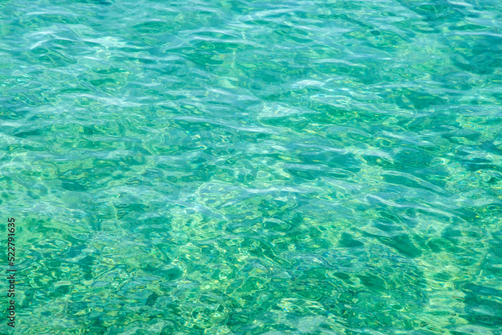Clear calm turquoise sea waters closeup as water background