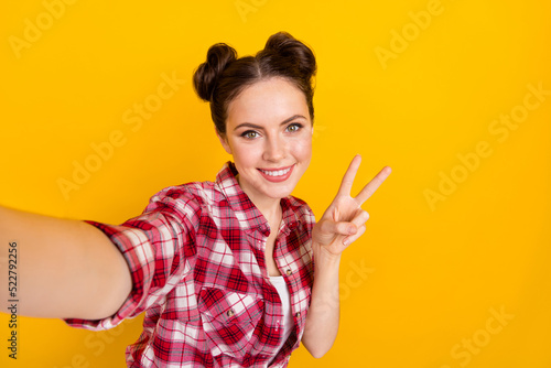 Portrait of positive lady greeting followers make v-sign selfie image isolated on bright color background