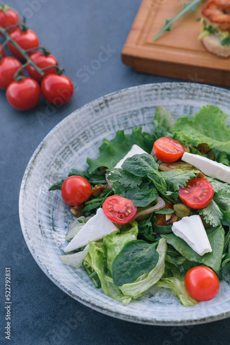 Food photography of a fresh vegetables and feta salad. Mediterranean diet. Fresh vegetarian dish.