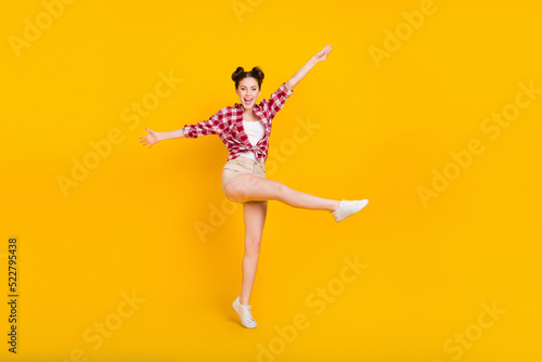 Full size photo of pretty adorable lady youth enjoy walk trip raise hands up isolated shine color background