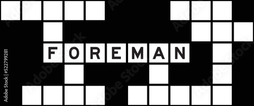 Alphabet letter in word foreman on crossword puzzle background
