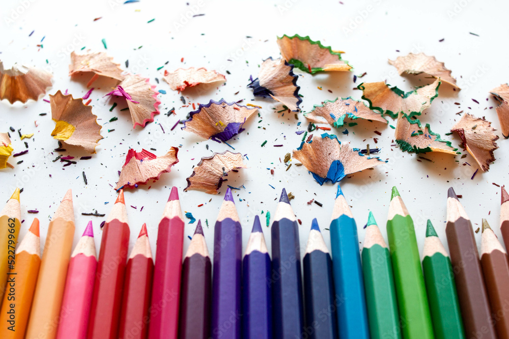 Crayons - Color pencils isolated with pencil shavings on white background. Crayons - Color pencils isolated with pencil shavings on white background.