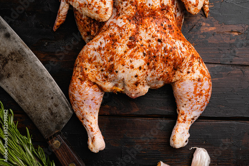 Raw marinated chicken prepared in Asian style, on old dark wooden table background, top view flat lay