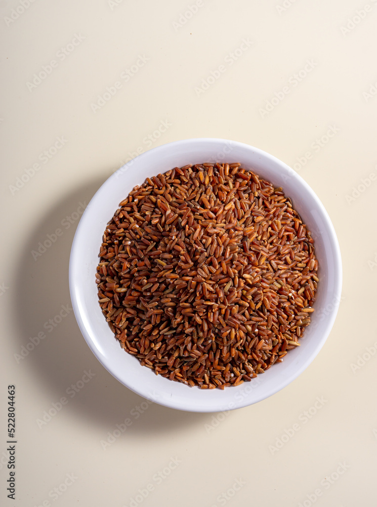 Uncooked rice assortment in bowl on white background. Top view. Uncooked rice assortment in bowl on white background. Top view.
