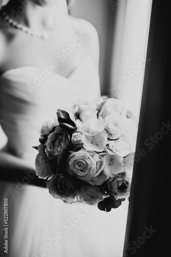 Bride holding big and beautiful wedding bouquet with flowers