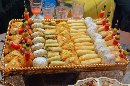 Moroccan salty and sweet appetizers are served at weddings and birthdays. The concept of cooking in Morocco photo