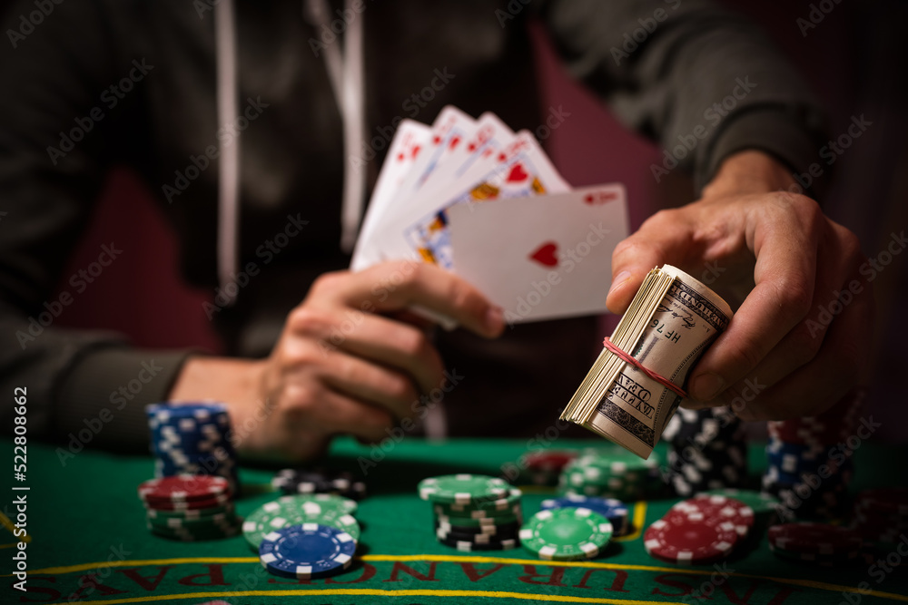 Player peeking cards in Blackjack game Player peeking cards in Blackjack game