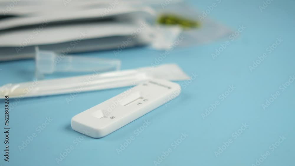 self covid-19 test kit on blue background self covid-19 test kit on blue background