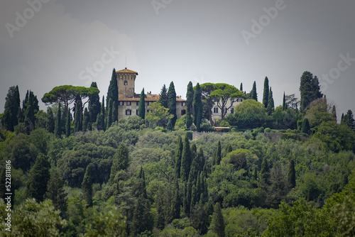A view of a Tuscan hill with castle on top 