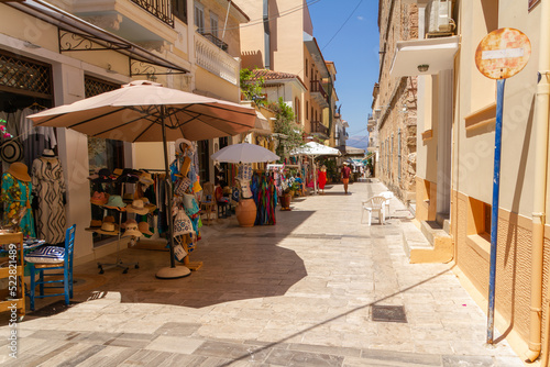 Fototapeta Naklejka Na Ścianę i Meble -  Nafplio, Greece, July 19, 2022. Street with shops for tourists