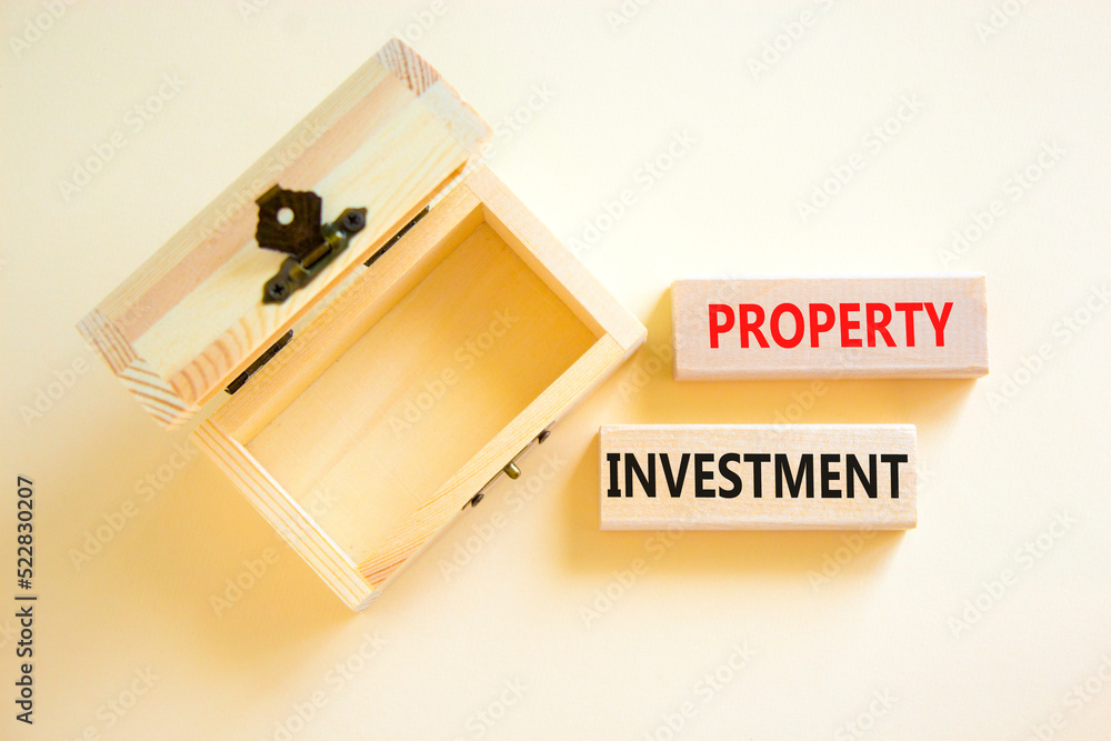 Property investment symbol. Concept words Property investment on wooden blocks on a beautiful white table white background. Empty wooden chest. Business Property investment concept. Copy space. Property investment symbol. Concept words Property investment on wooden blocks on a beautiful white table white background. Empty wooden chest. Business Property investment concept. Copy space.