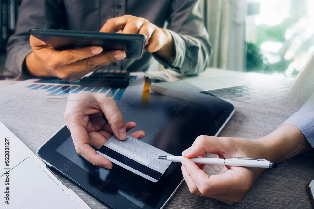 Hands holding credit card and using laptop. Online shopping Hands holding credit card and using laptop. Online shopping