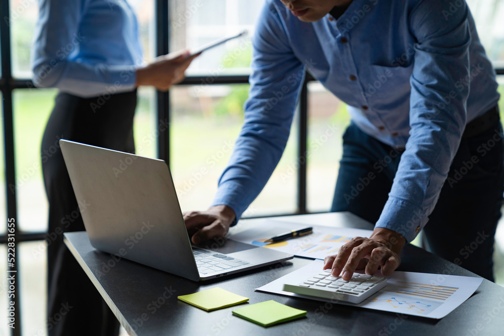 Teamwork of business team consulting market growth on financial document graph report statistics, professional presentation analyzing investment project Teamwork of business team consulting market growth on financial document graph report statistics, professional presentation analyzing investment project