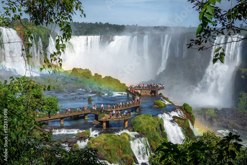 Tourists exploring the Brazilian side of Iguazu Falls in Foz do Iguacu, Brazil. 