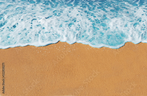 Soft wave of the blue ocean at the beach, Beach background and scenery, The Beautiful beach at Summer in Thailand,  Beach and sea for background and wallpaper © Natyada