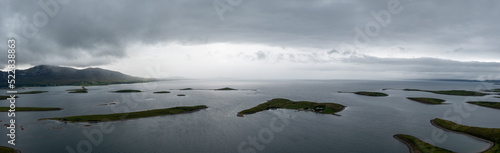 panorama landscape of the sunken drumlin islands of Clew Bay in County Mayo with a rain storm moving in photo