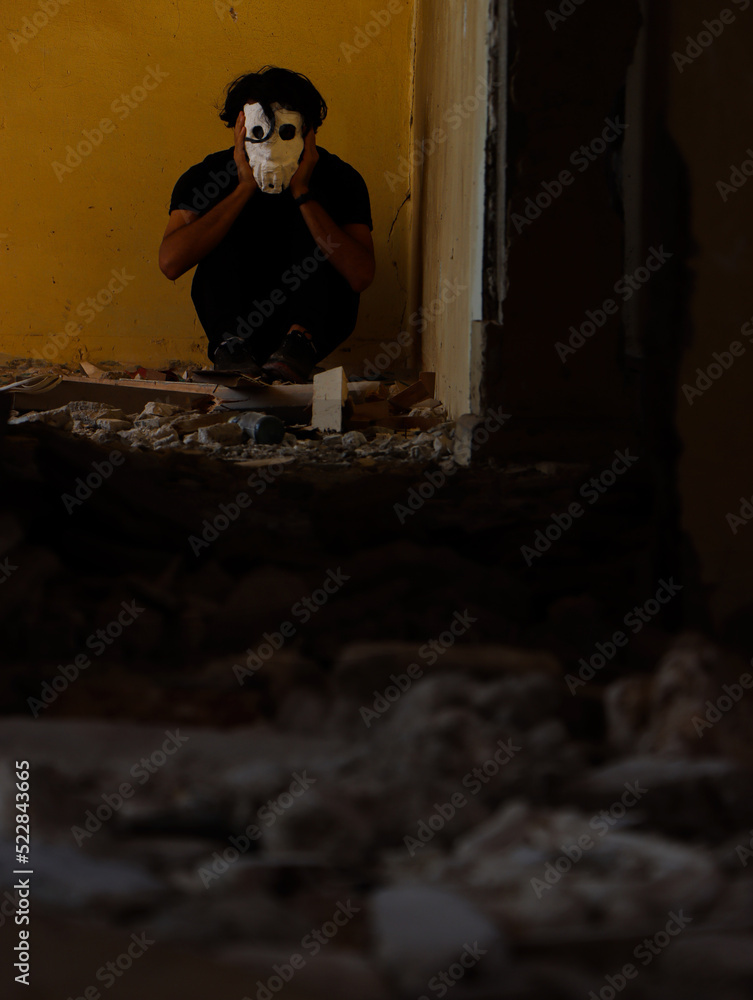 Fototapeta premium an iranian guy in ruins no peace found
