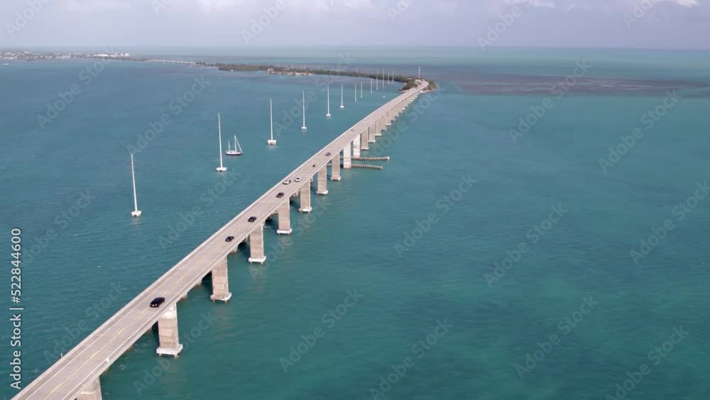 Aerial Time Lapse Shot Of Cars Moving On Famous Bridge, Drone Flying Forward During Sunny Day - Florida Keys, Florida Aerial Time Lapse Shot Of Cars Moving On Famous Bridge, Drone Flying Forward During Sunny Day - Florida Keys, Florida