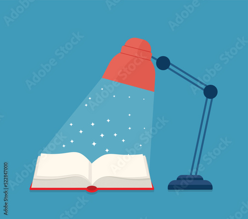 open book under a lamp with stars and sparkles