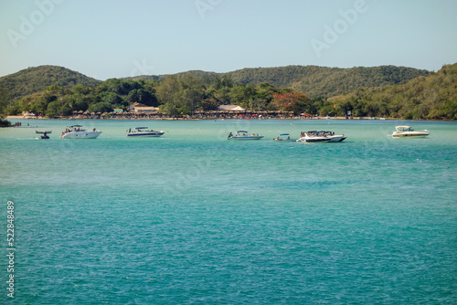 yachts moored at idyllic sea channel on tropical island. Summer vacation and travelling