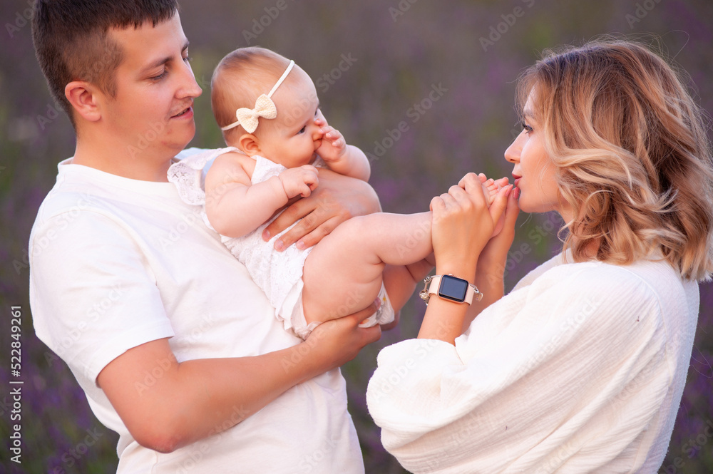 Beautiful young family on purple flower lavender field. Family vacation Beautiful young family on purple flower lavender field. Family vacation