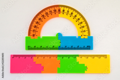ruler and protractor multi-colored for drawing and geometry for schoolchildren on a white background