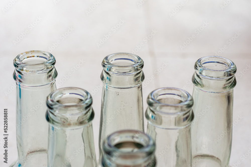 Close up empty soft drinks glass bottles. Recycled glass concept. Close up empty soft drinks glass bottles. Recycled glass concept.