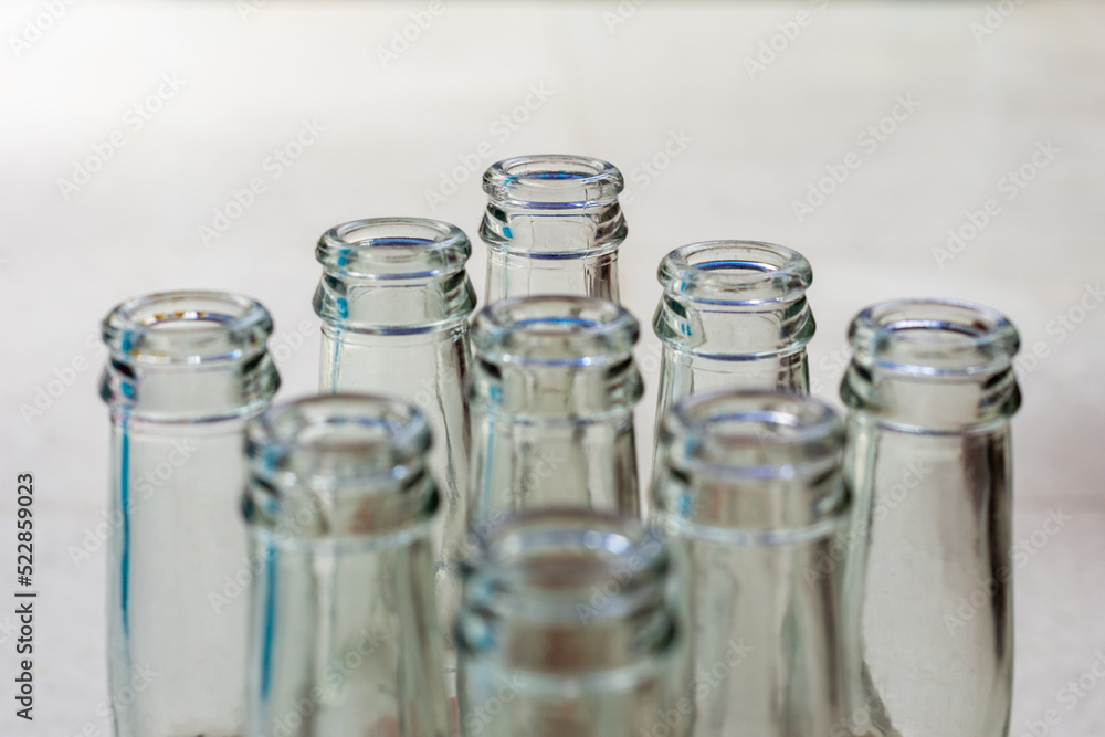 Close up empty soft drinks glass bottles. Recycled glass concept. Close up empty soft drinks glass bottles. Recycled glass concept.