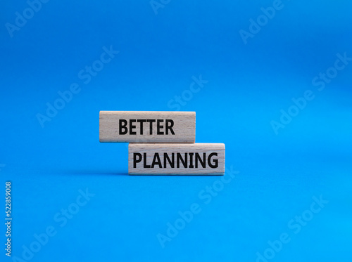 Better planning symbol. Concept word Better planning on wooden blocks. Beautiful blue background. Business and Better planning concept. Copy space