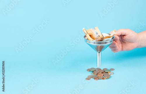 Εκτύπωση καμβά Inflation and financial crash, euro banknotes in a funnel become coins, economic