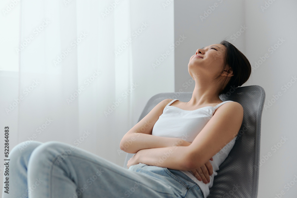 Abortion high Pregnancy lost. Tormented suffering tanned beautiful young Asian woman touch stomach looks up at home interior living room. Injuries Poor health Illness concept. Cool offer Banner Abortion high Pregnancy lost. Tormented suffering tanned beautiful young Asian woman touch stomach looks up at home interior living room. Injuries Poor health Illness concept. Cool offer Banner