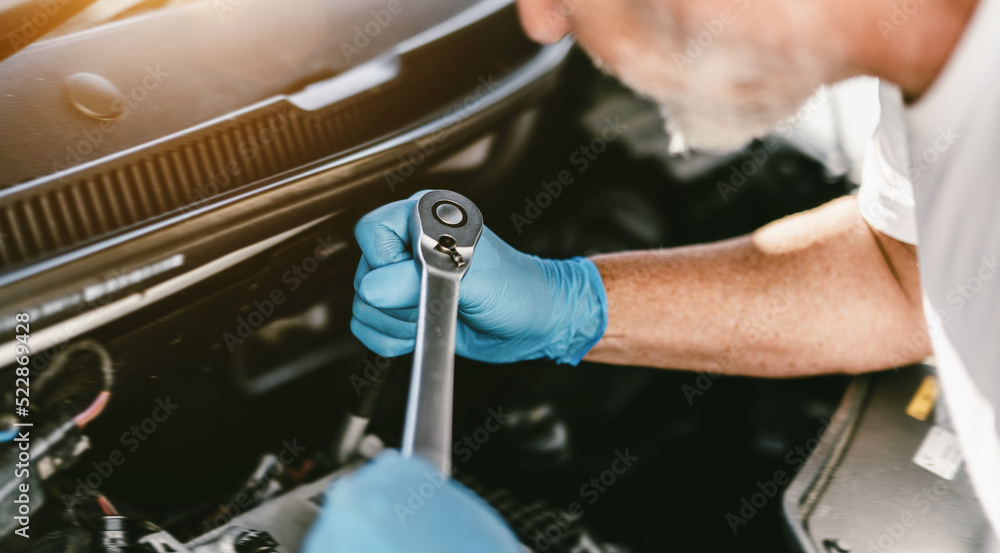Auto mechanic working in garage. Repair service. Auto mechanic working in garage. Repair service.