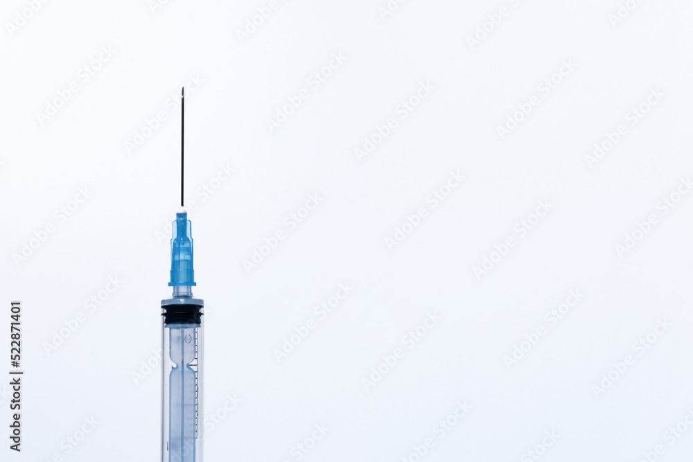 On a white background, a disposable plastic open syringe, preparation for an injection, medical care, isolate