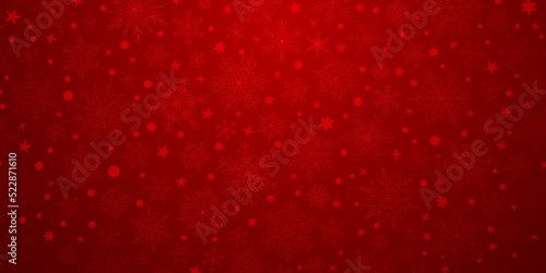 Background of complex big and small Christmas snowflakes in red colors. Winter illustration with falling snow