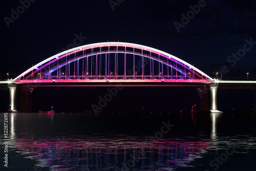 Seascape with a view of the Crimean Bridge in the night illumination © vvicca