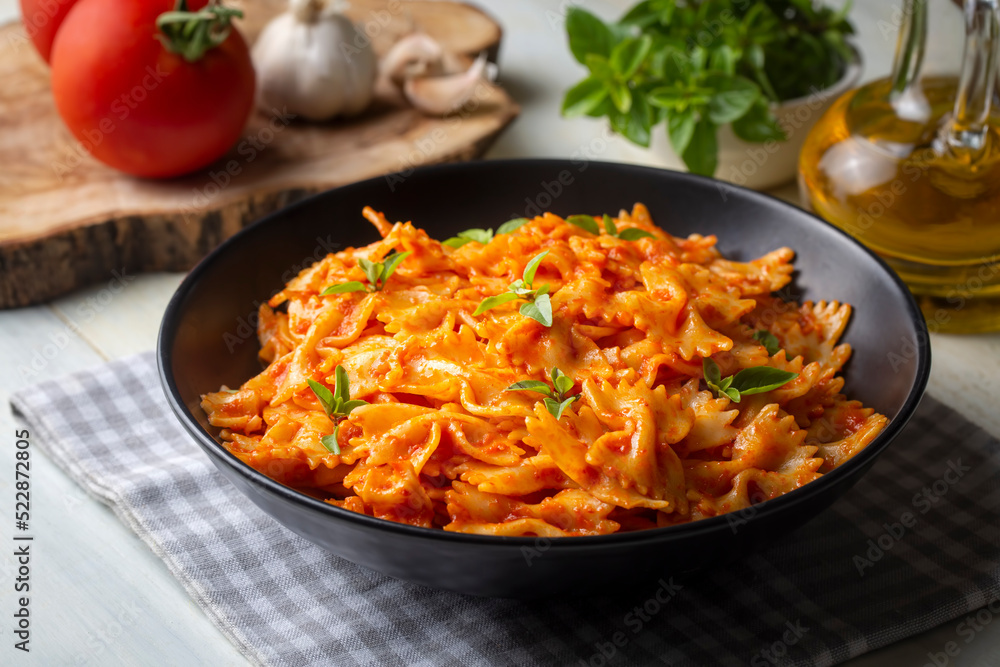 Farfalle pasta with tomato sauce, bow tie pasta tomatoes sauce (Turkish name; domatesli kelebek makarna) Farfalle pasta with tomato sauce, bow tie pasta tomatoes sauce (Turkish name; domatesli kelebek makarna)