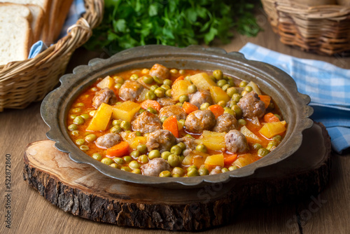 Turkish Food Green Pea Stew with Meatballs - Kofte or Kofta Bezelye. (Turkish name; kofteli bezelye) photo