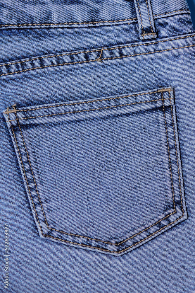 Denim pockets, pockets of denim shorts back view, on a blue background Denim pockets, pockets of denim shorts back view, on a blue background