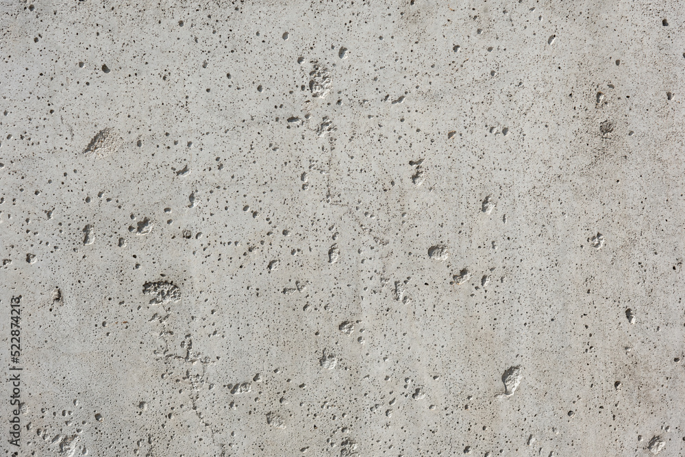 Gray cement wall, with holes and cracks, rough raw surface, construction work, interior design Gray cement wall, with holes and cracks, rough raw surface, construction work, interior design