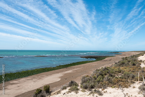 Sandy beach and blue ocean water. Península Valdés, Argentina. 