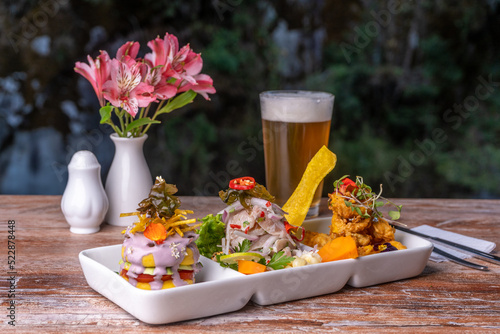 Seafood trio, ceviche with fish crackling and seafood cause, is a typical dish of Peru.