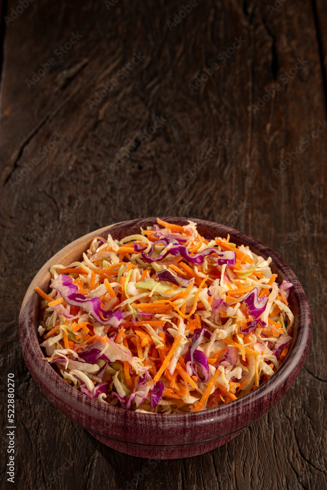 Coleslaw salad with white cabbage, red cabbage and sliced carrots. Coleslaw salad with white cabbage, red cabbage and sliced carrots.