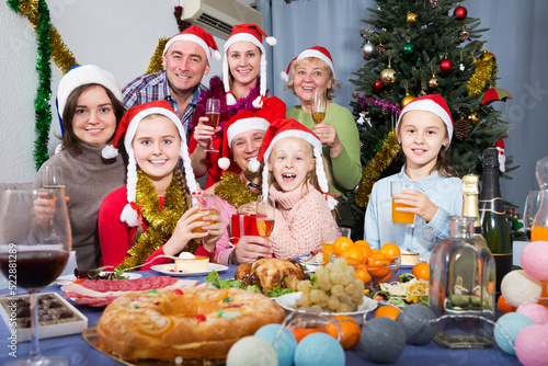 Portrait of cheerful family who is celebration New Year together at home