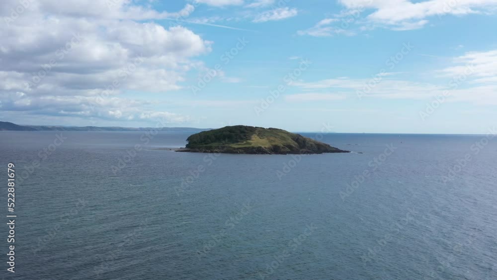 Wide aerial orbit of St. Georges Island, off the coast of Looe, Cornwall, UK. Wide aerial orbit of St. Georges Island, off the coast of Looe, Cornwall, UK.