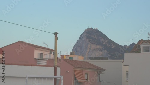 A rooftop time-lapse at sunset looking at the rock of gibraltar from a rundown town in southern Spain.